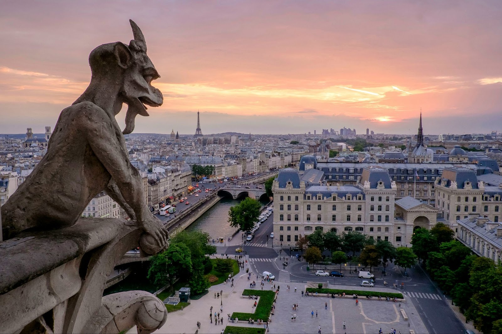Gargoyle overlooking a sunset in Paris